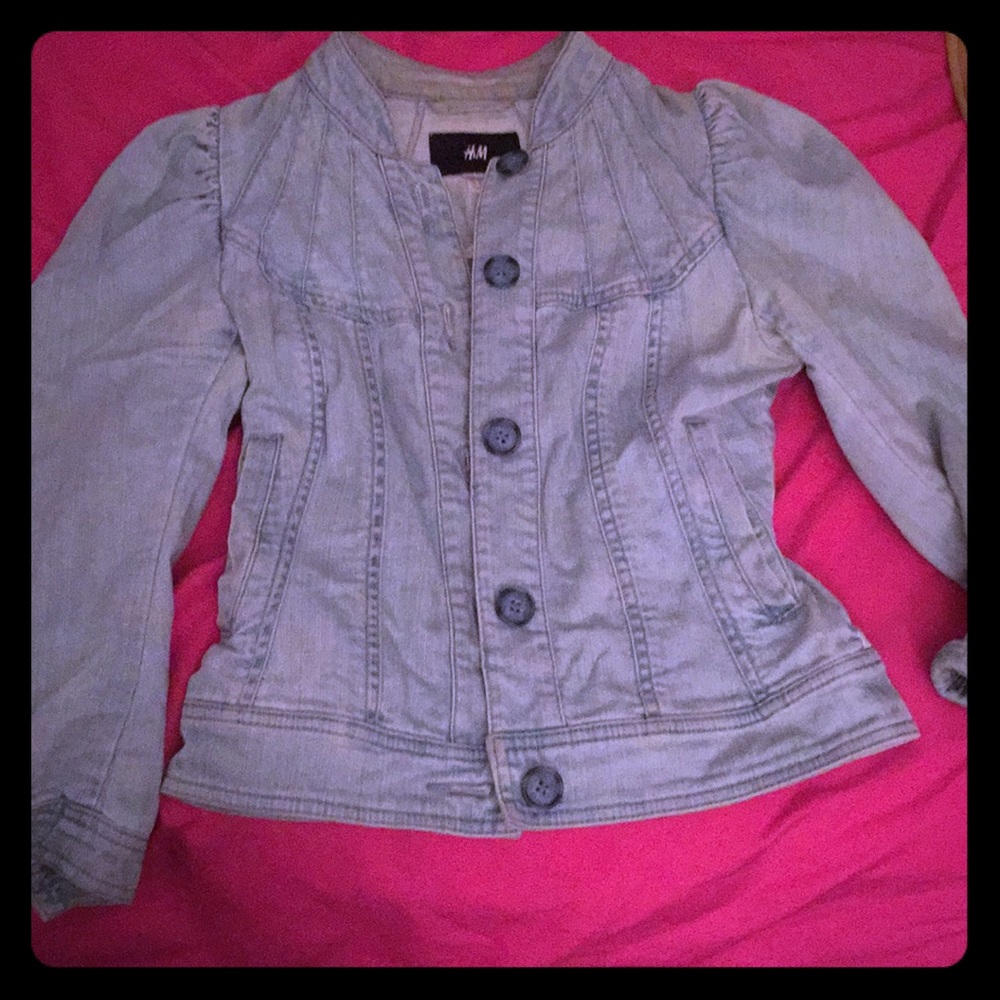 Denim peplum jacket with puffy shoulders.